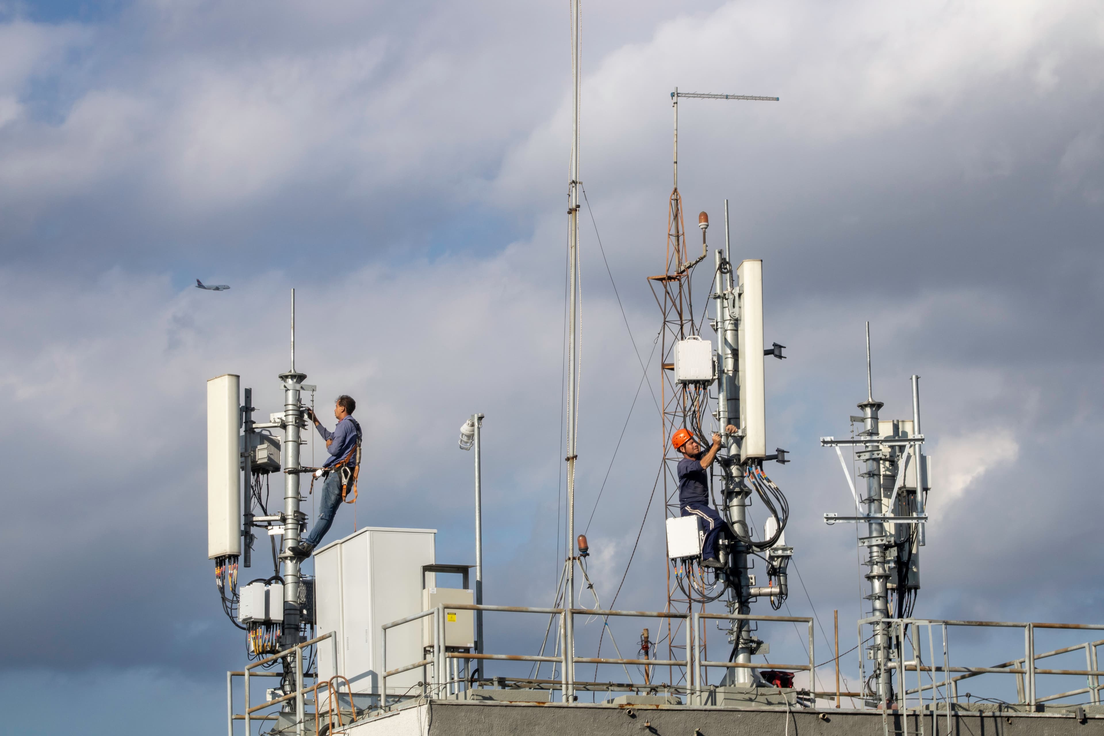 Engineers working on telecommunications infrastructure